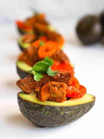 A lineup of Puerto Rican Steak Stuffed Avocados.
