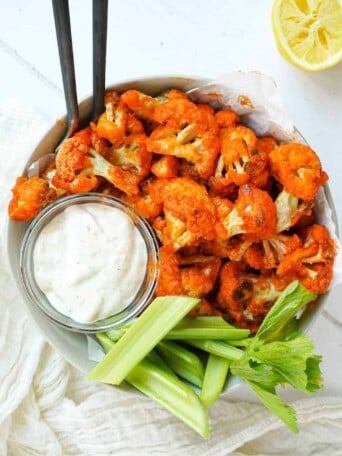 A bowl of crispy oven baked buffalo cauliflower.