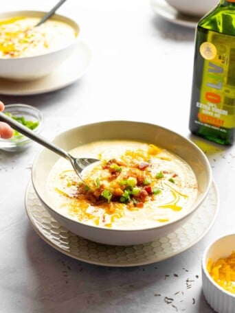 A spoon full of cauliflower soup.