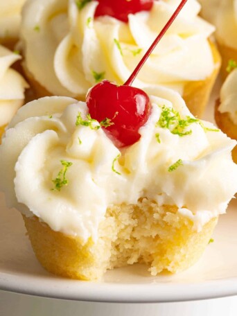 a plate of piña colada cupcakes