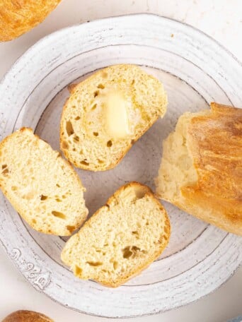 A plate of pan de agua with butter