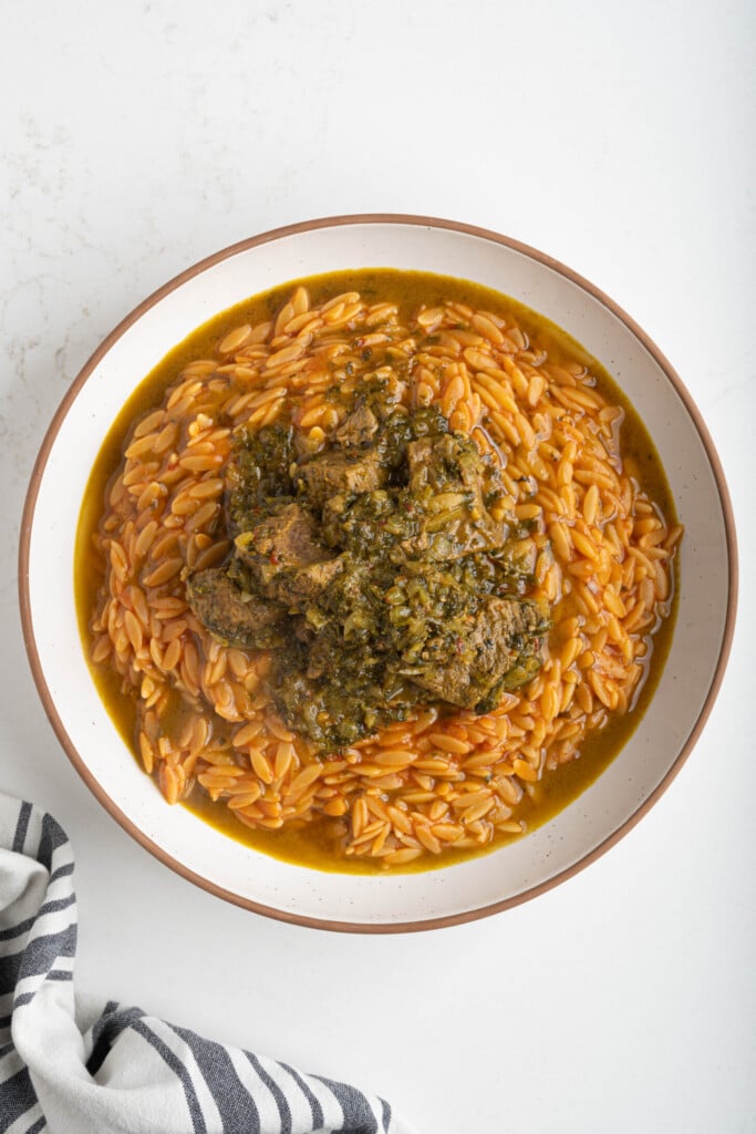 a bowl of orzo with lamb