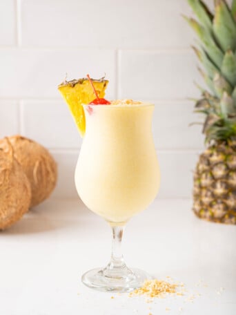 A piña colada on a white counter.