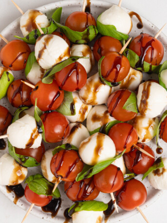 A plate of caprese salad skewers.