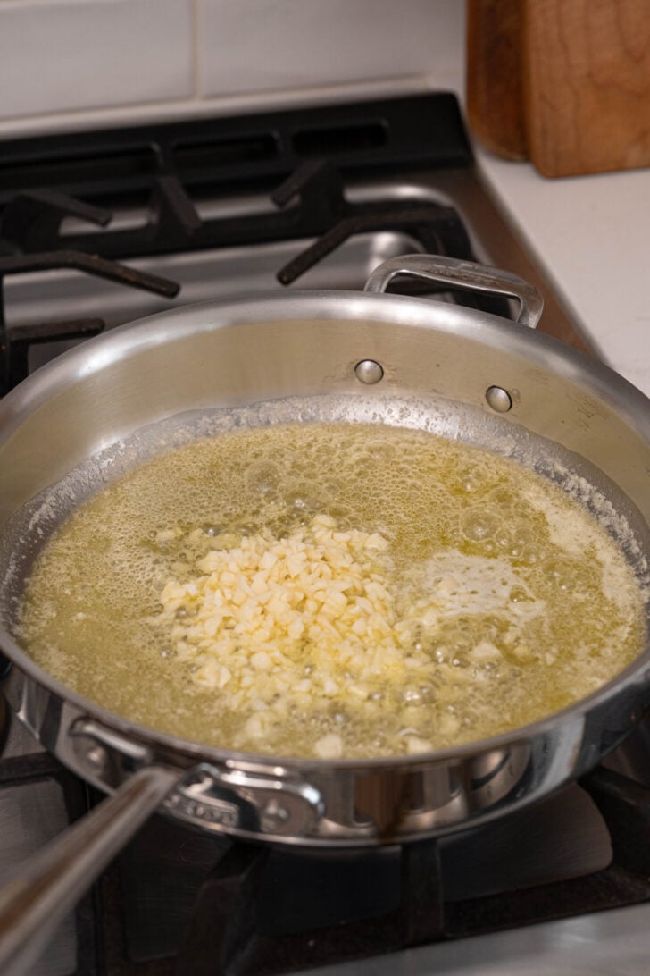 A pan with butter and garlic.