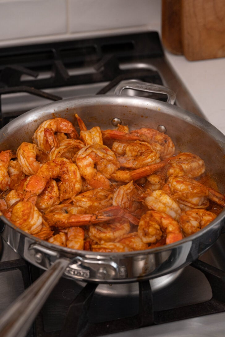 A pan with garlic butter shrimp.