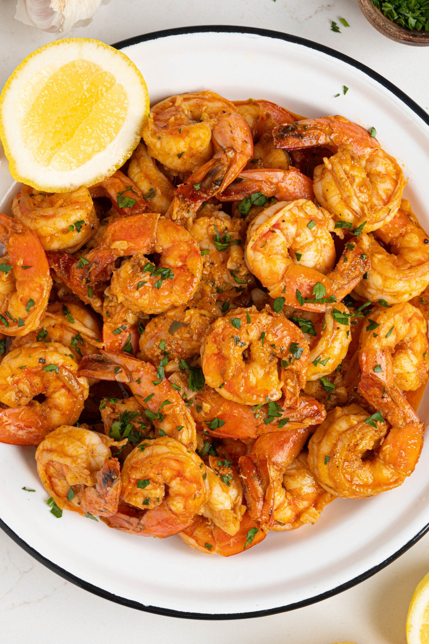A plate of camarones al ajillo.