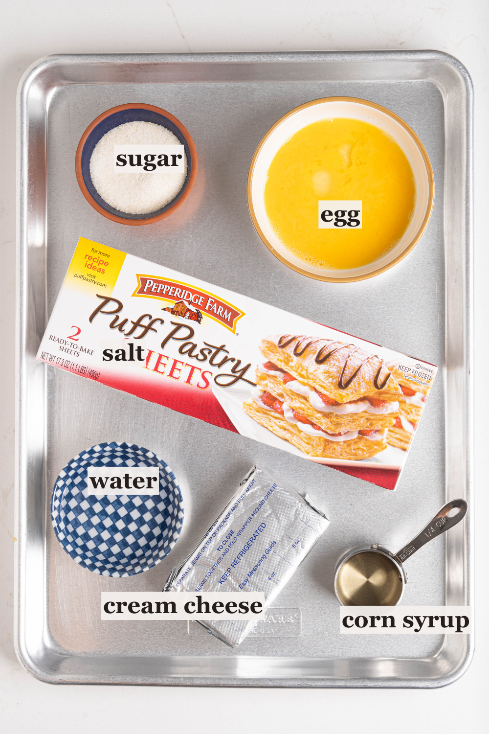 Bowls of sugar, water, egg, and more.