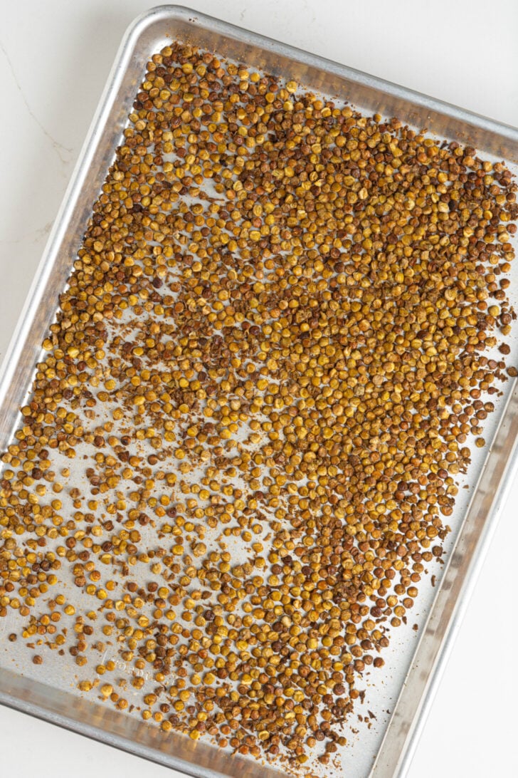 Crusade lentils on baking sheet.