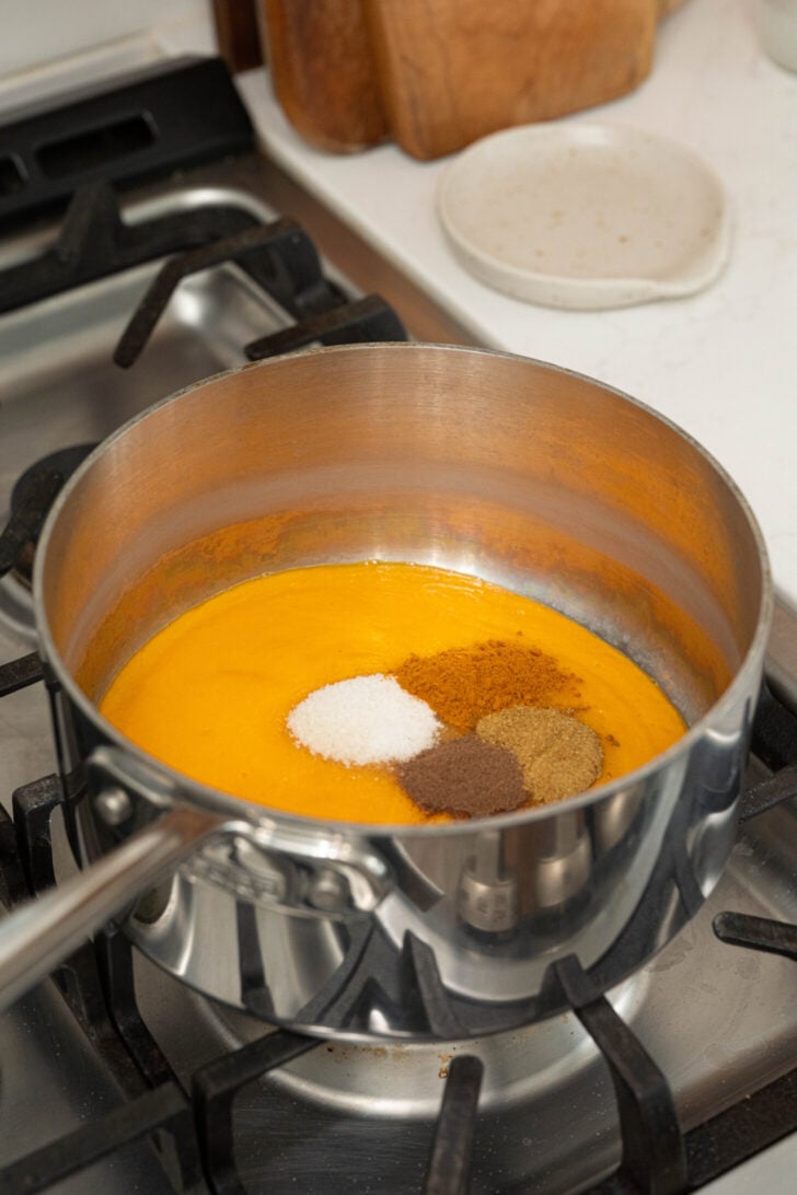 Spices and mango hubo hot sauce in a pot.