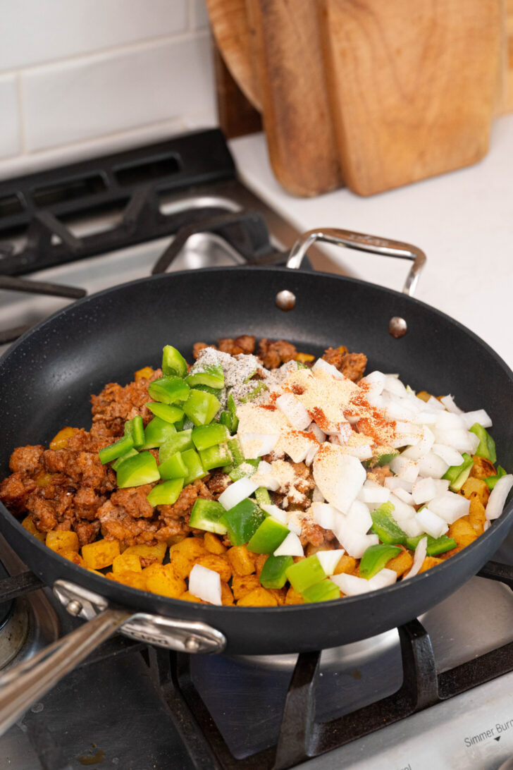 Potatoes, cores, and more in a pan.