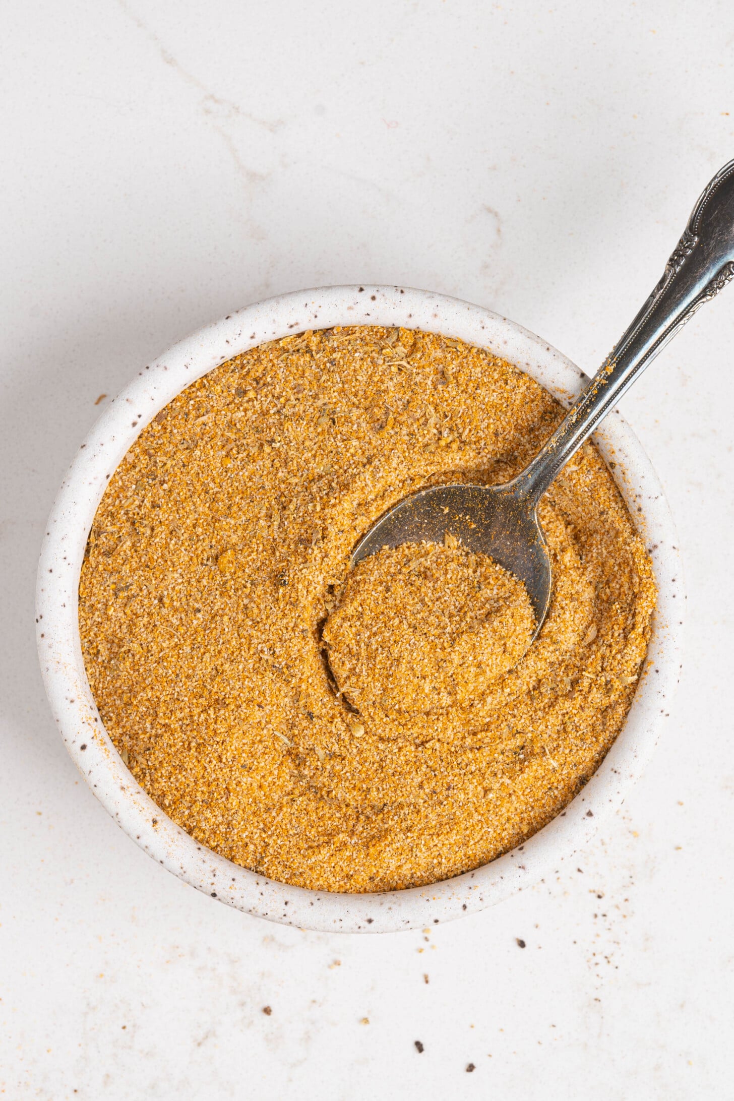 A bowl of adobo seasoning.