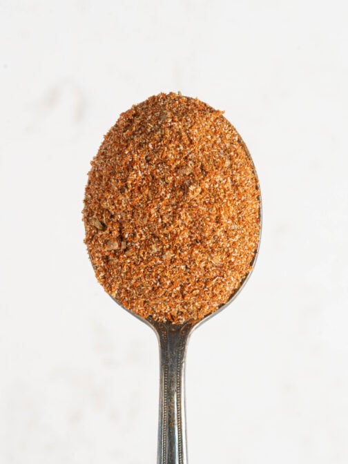 A spoonful of sazon seasoning.