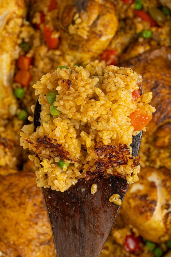 A spoon full of arroz con pollo.