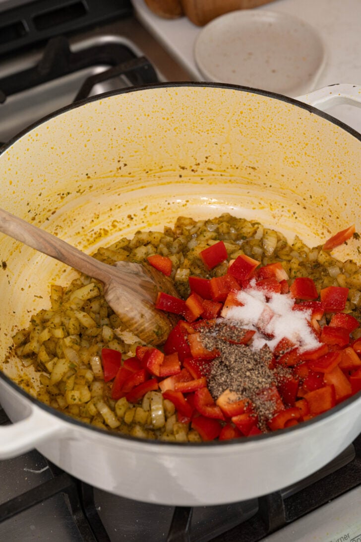 A pot with onions, spices, and more.