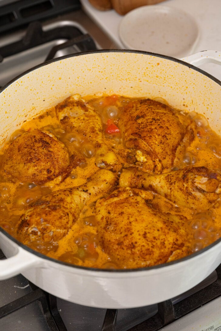 Arroz con pollo cooking in a pot.