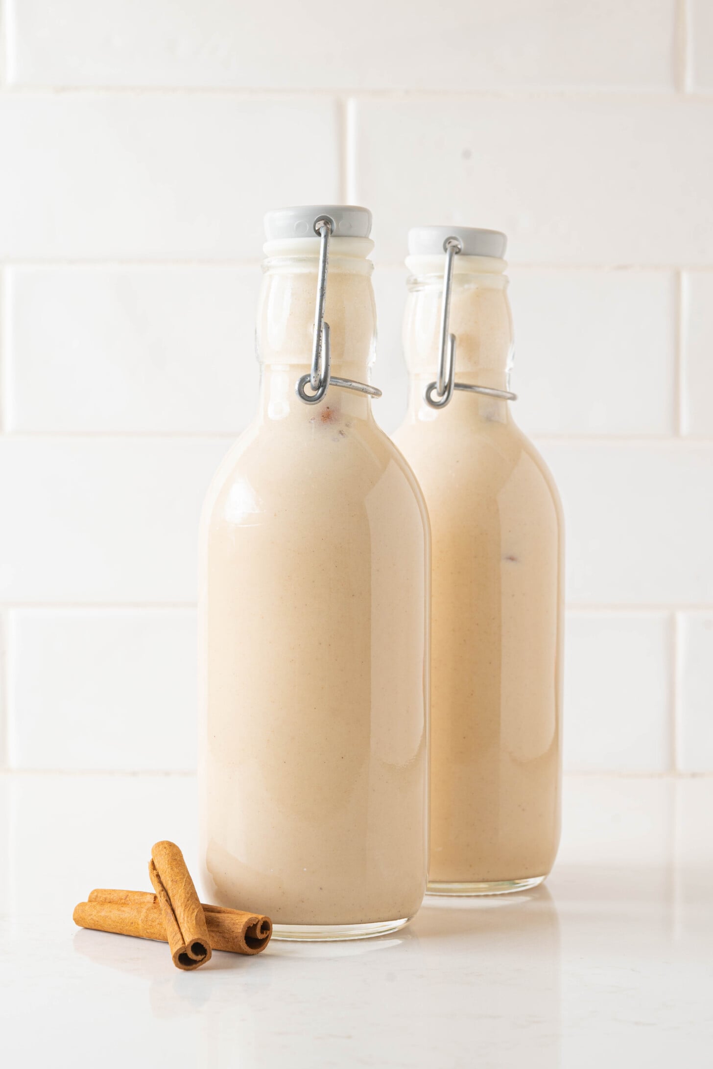 Bottles of coquito on a counter.