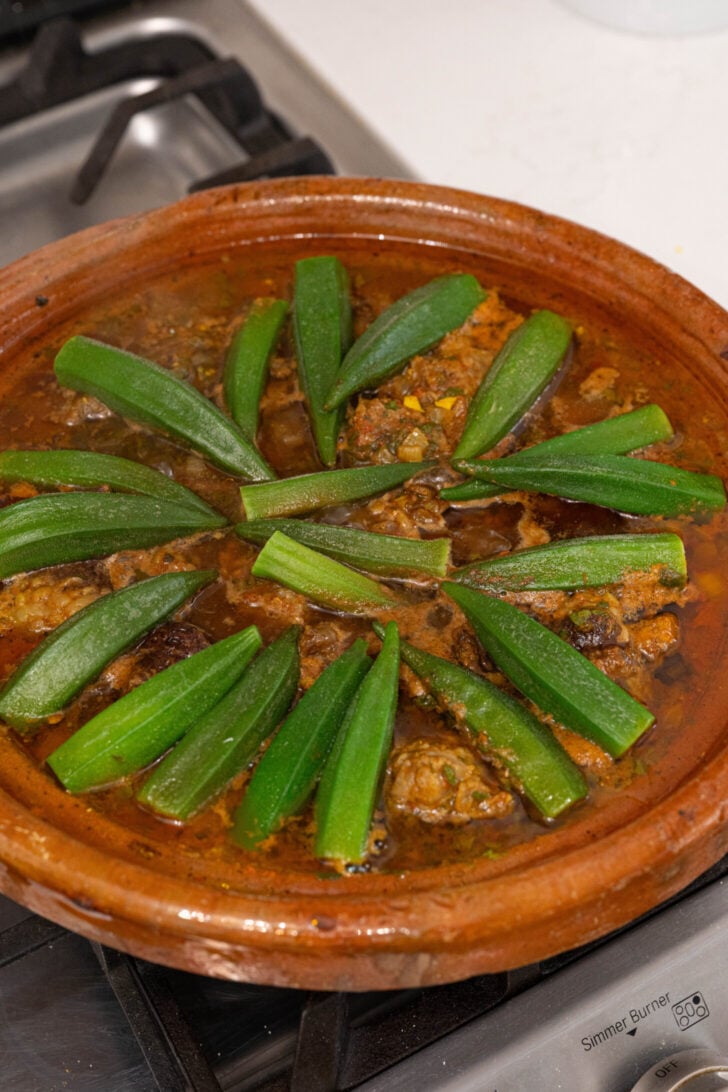 A tagine with okra on top.