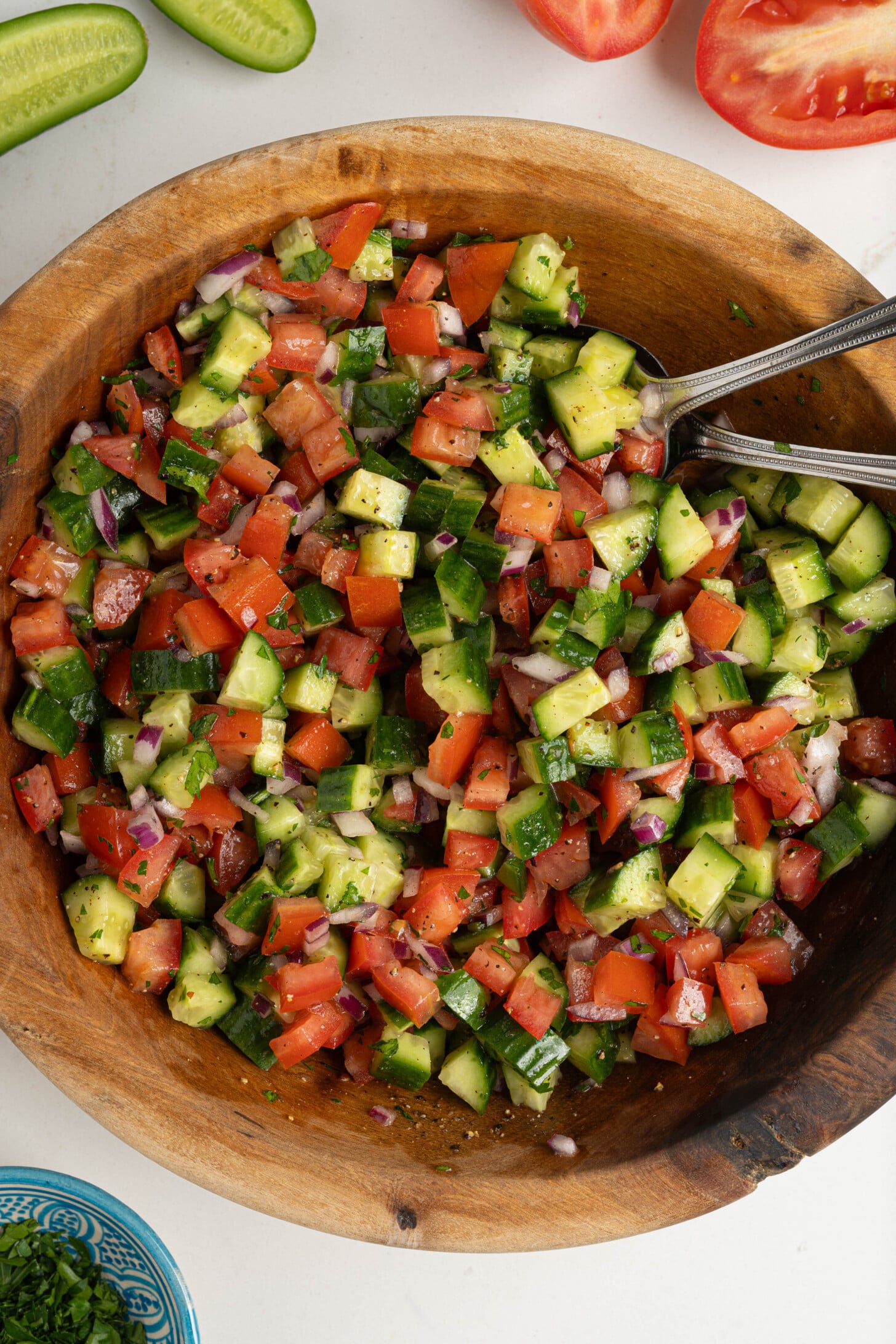 A bowl of Moroccan cucumber tomato salad.
