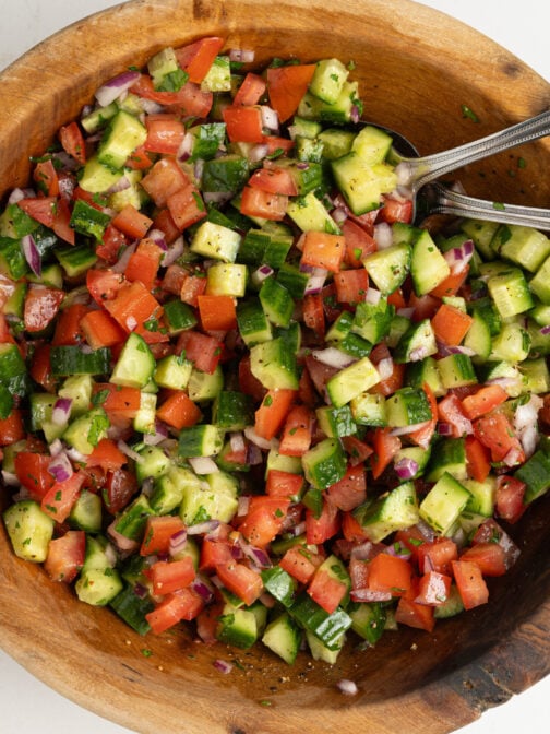 A bowl of Moroccan cucumber tomato salad.