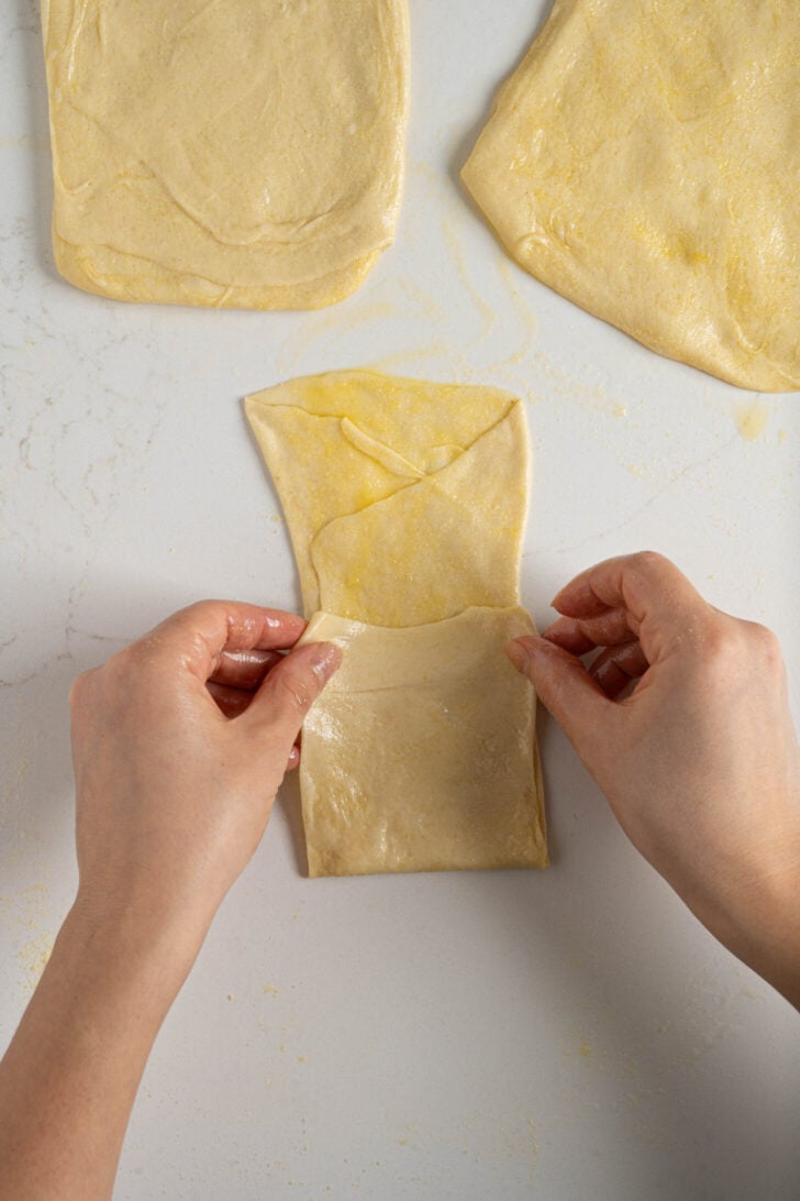 Msmen dough being folded.