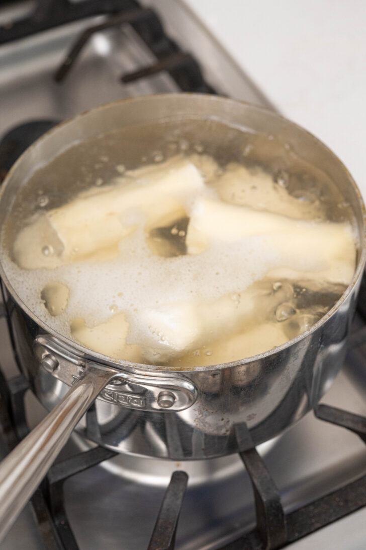 Yuca boiling in a pot.