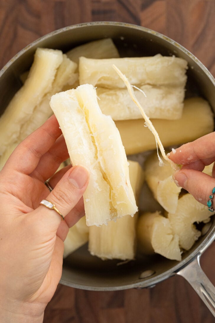 The core of yuca being removed.