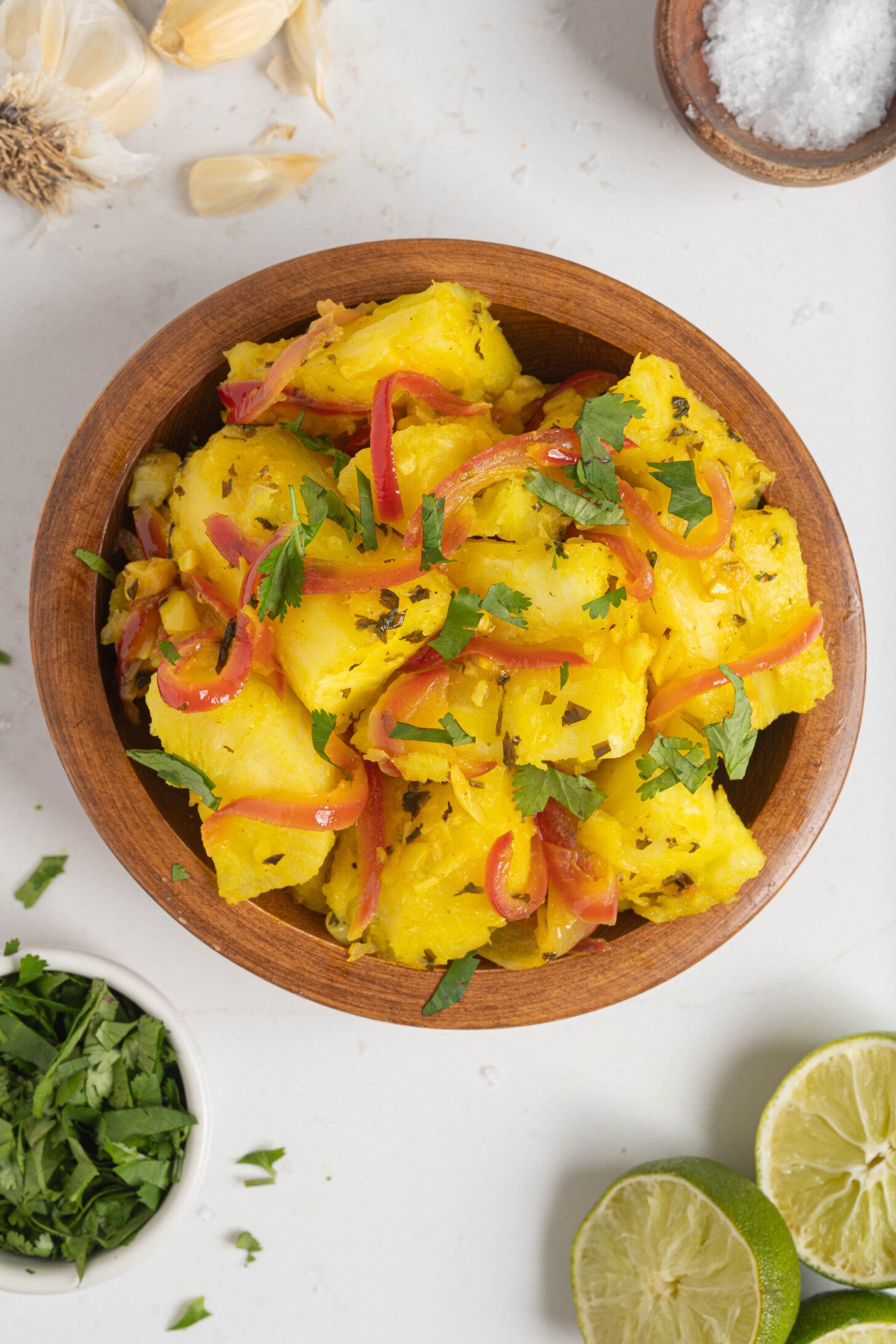 Yuca with garlic sauce in a bowl.
