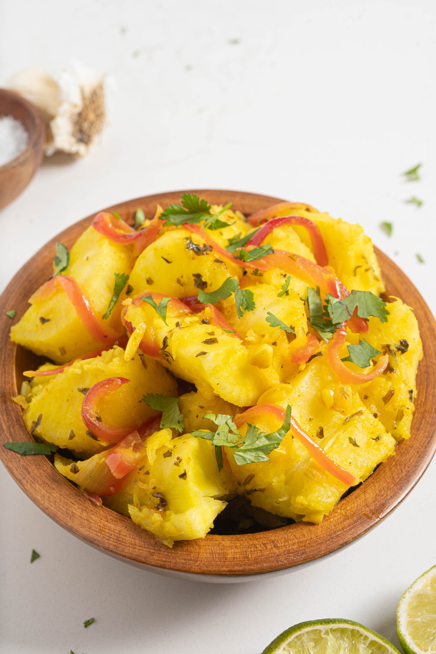 Yuca with garlic sauce in a bowl.