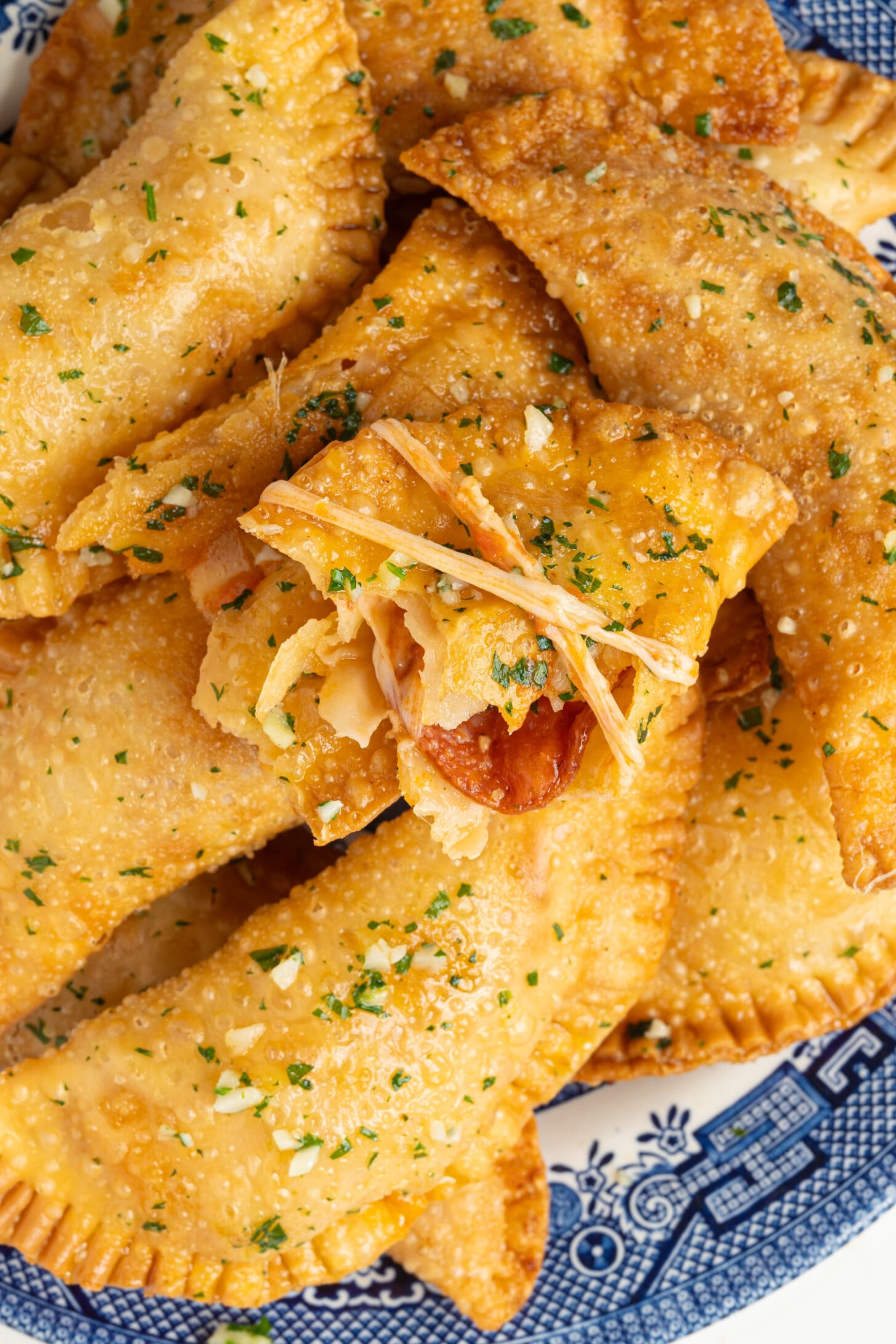 Pizza empanadas on a plate.