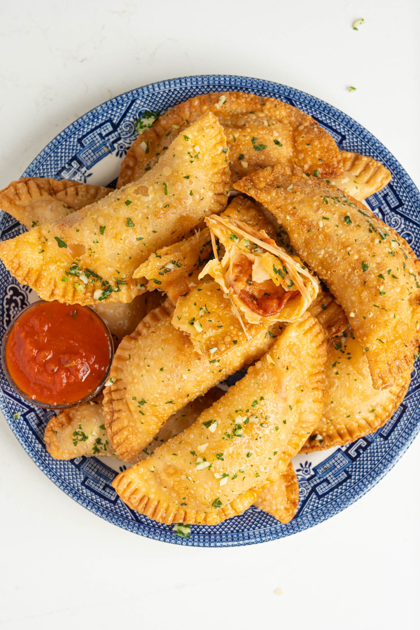Pizza empanadas on a plate.