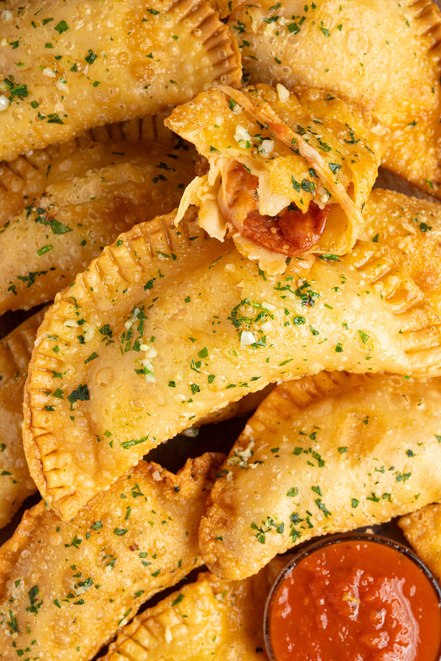 Pizza empanadas on a plate.
