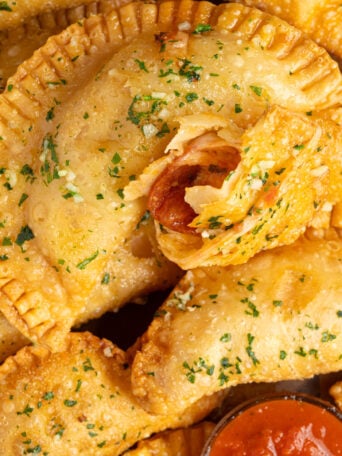 Pizza empanadas on a plate.