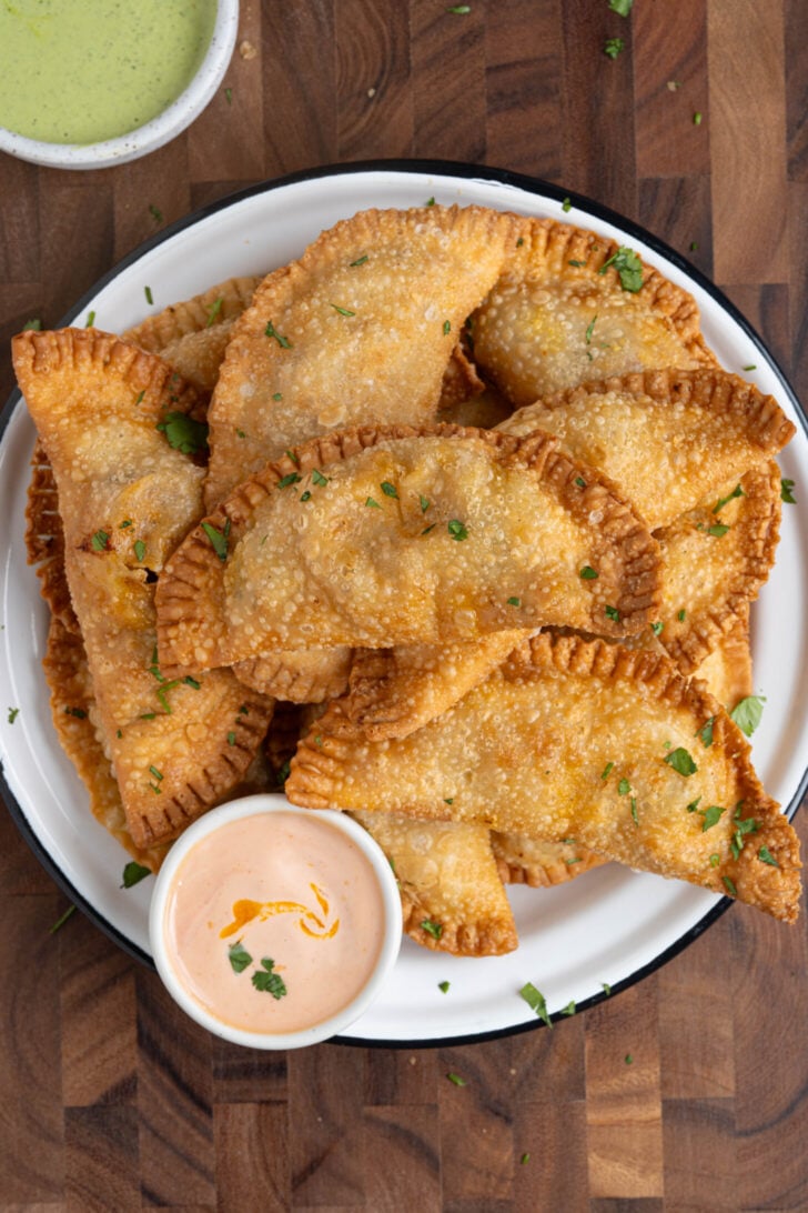 A plate of chicken empanadas.