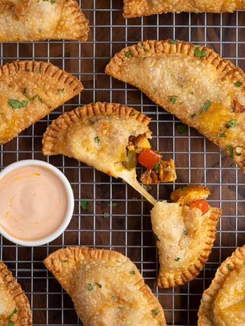 A tray of cheesy chicken empanadas.