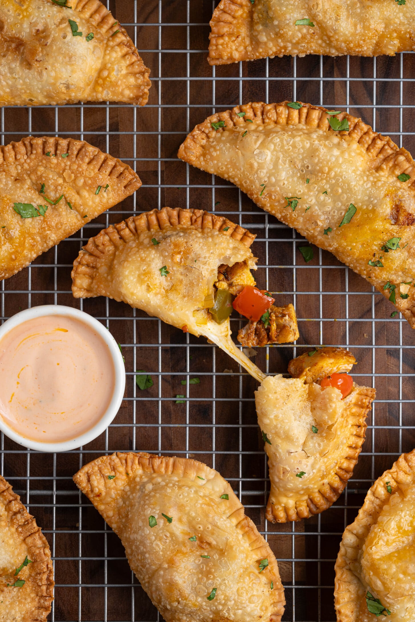 A tray of cheesy chicken empanadas.