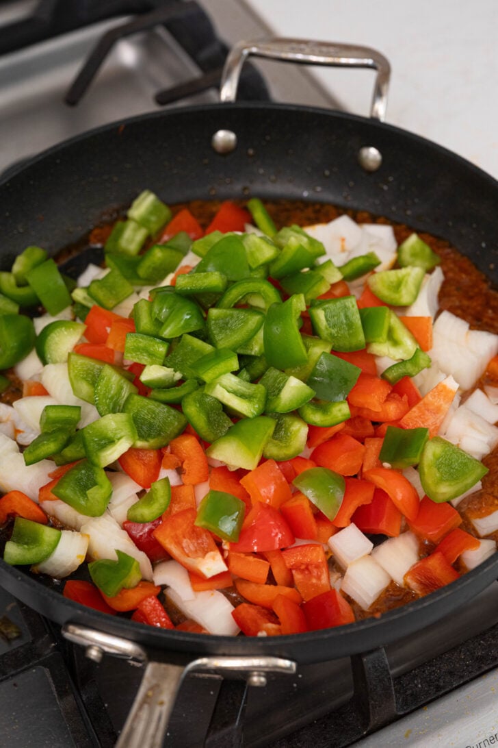 Peppers and onions frying in sofrito.