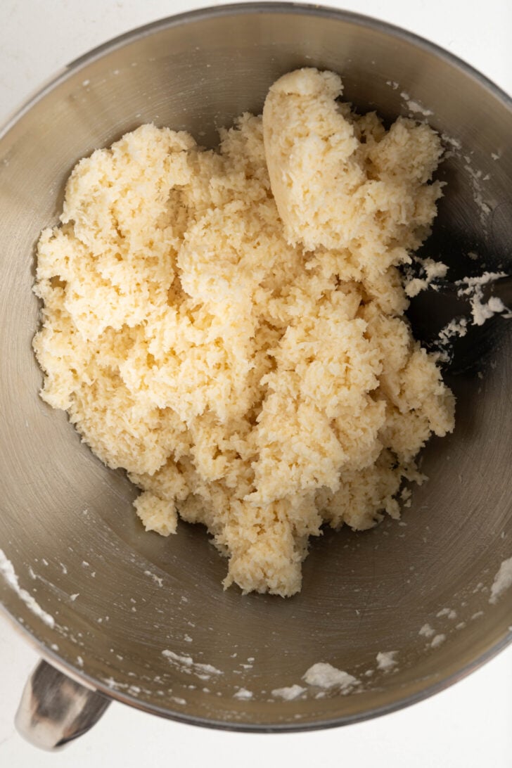 A bowl with coconut macaroon batter.