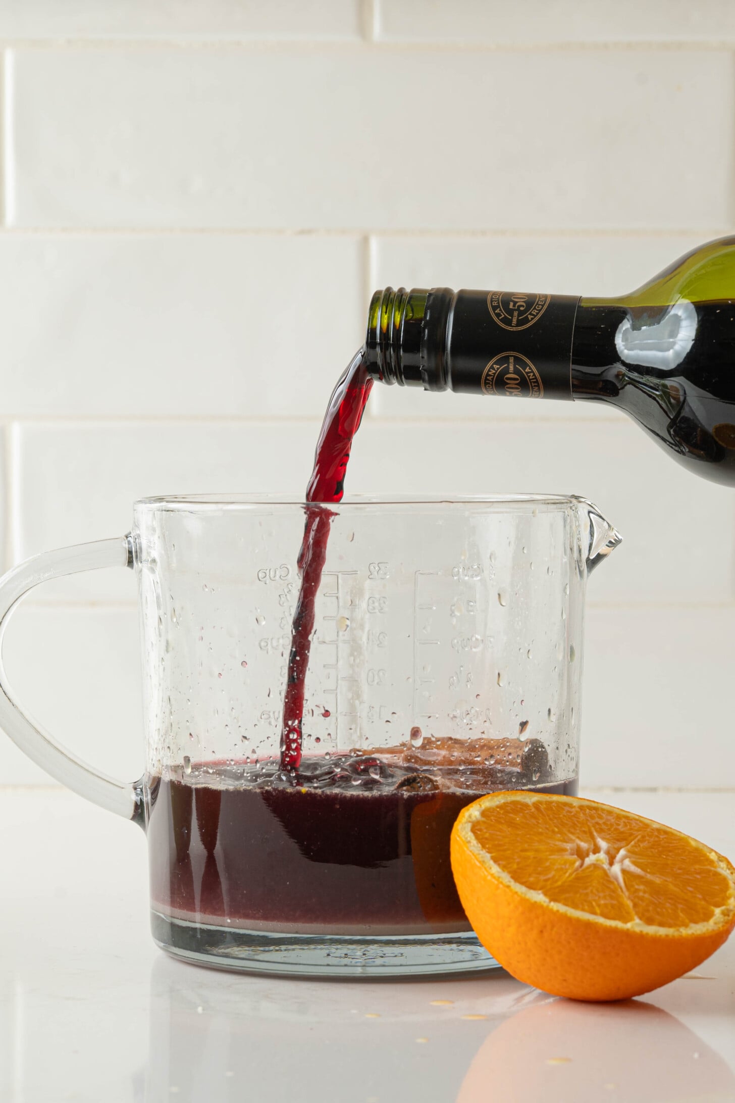 Wine pouring into a pitcher.