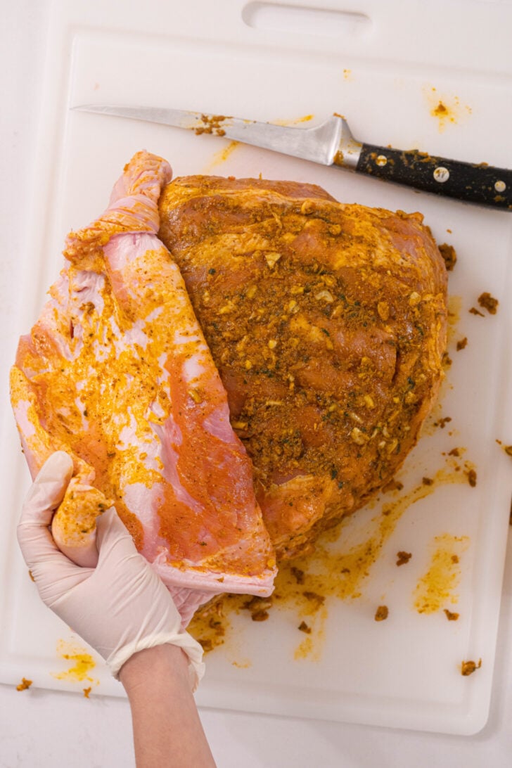 A marinated raw pork shoulder.