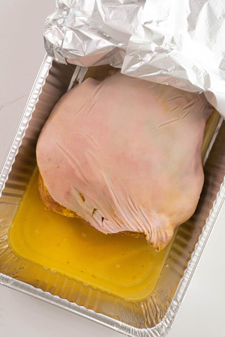 A marinated raw pork shoulder.