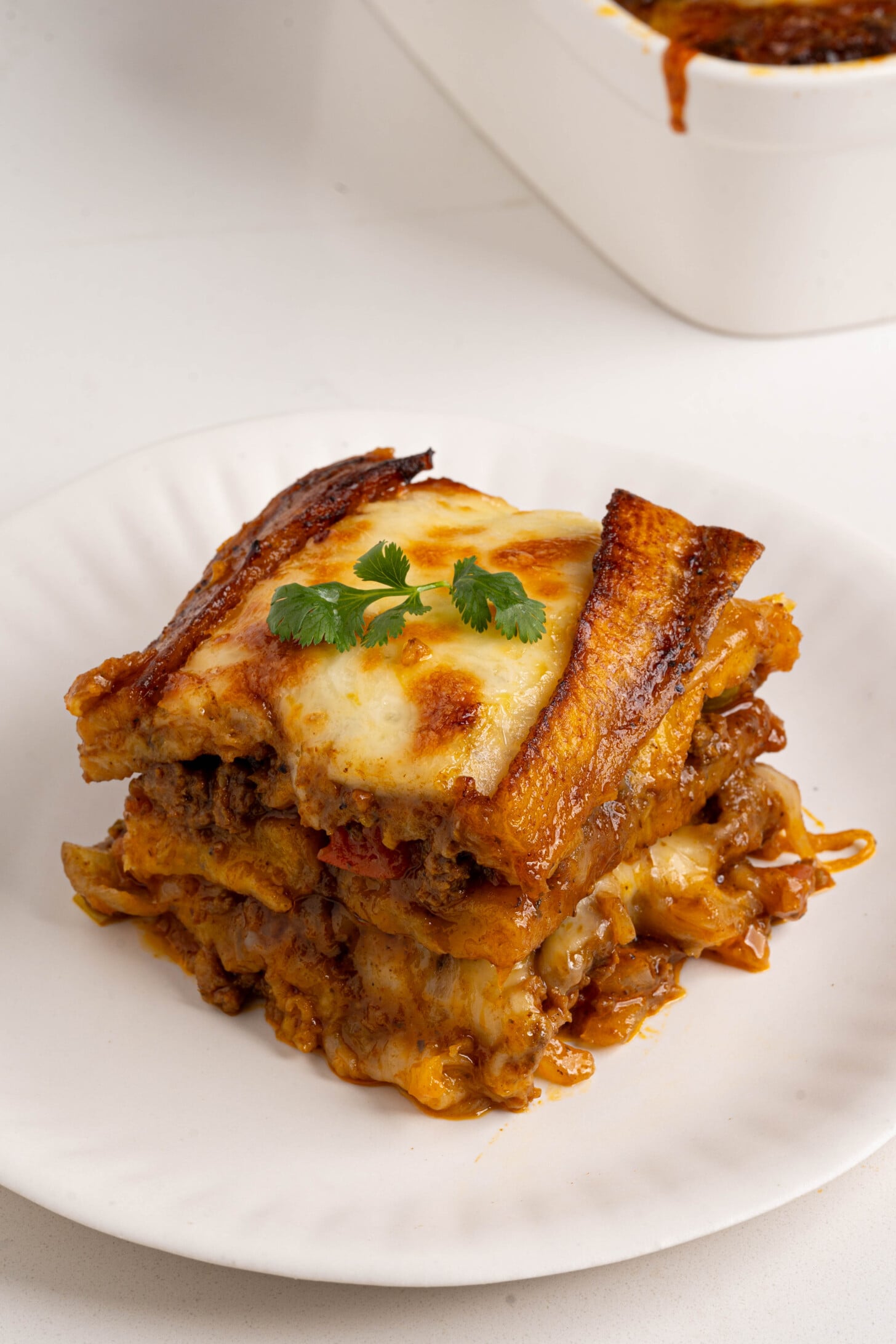 A slice of pastelon on a plate.