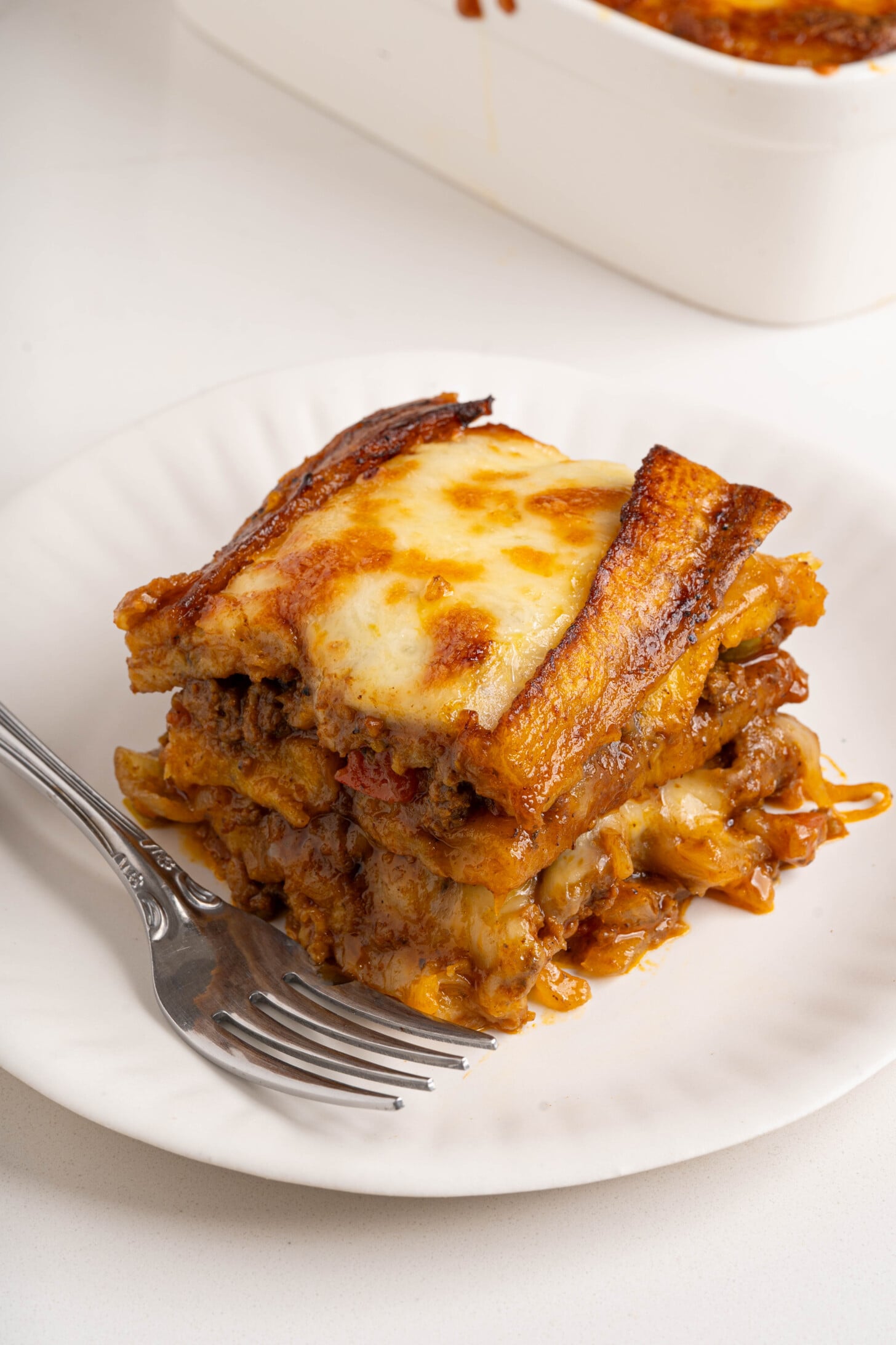 A slice of pastelon on a plate.