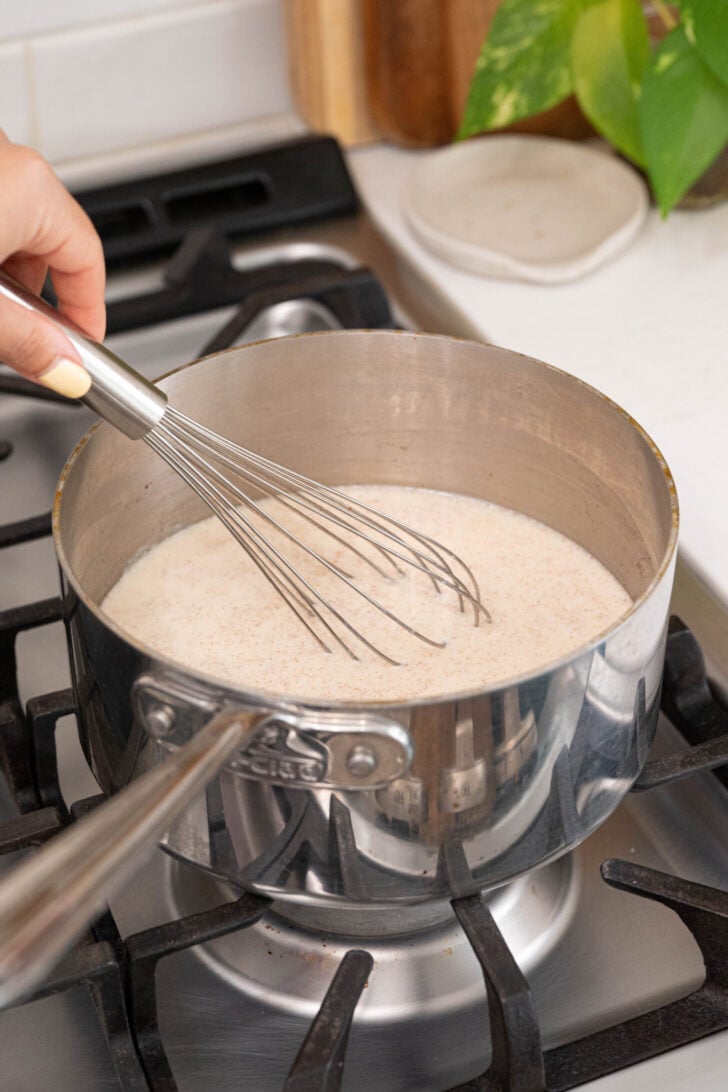 Farina being whisked in a pot.