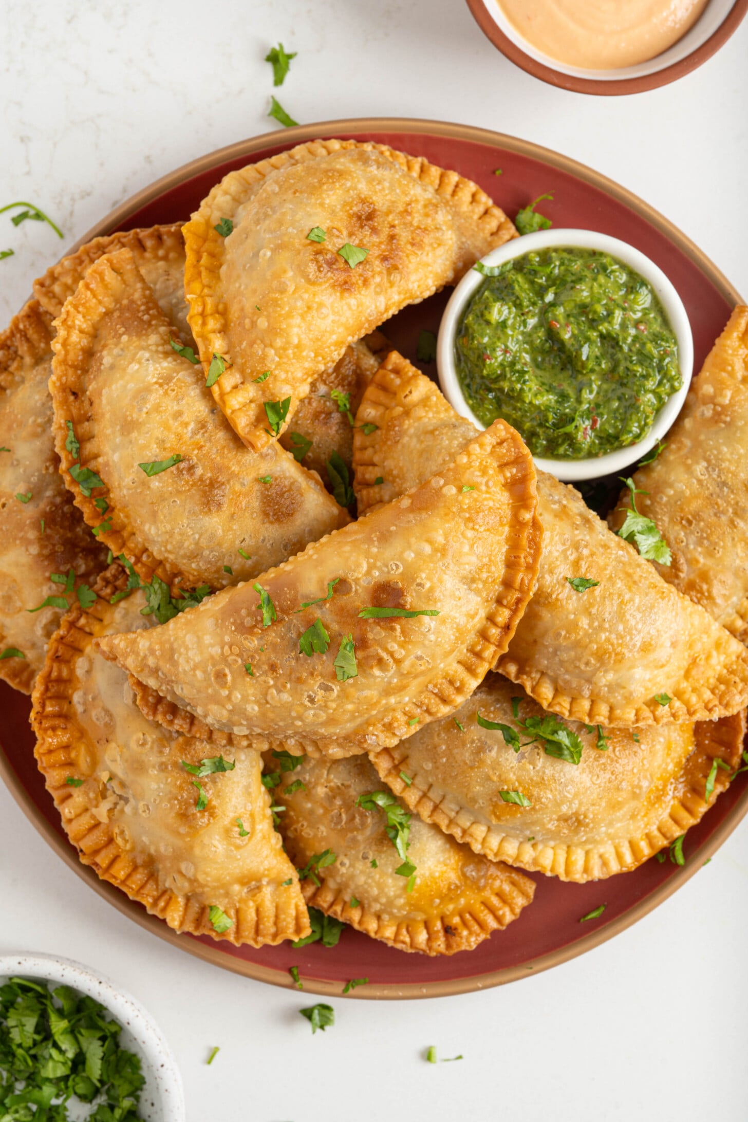 A plate of ground beef empanadas.