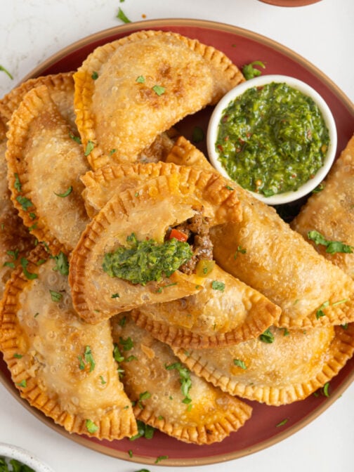 A plate of ground beef empanadas.