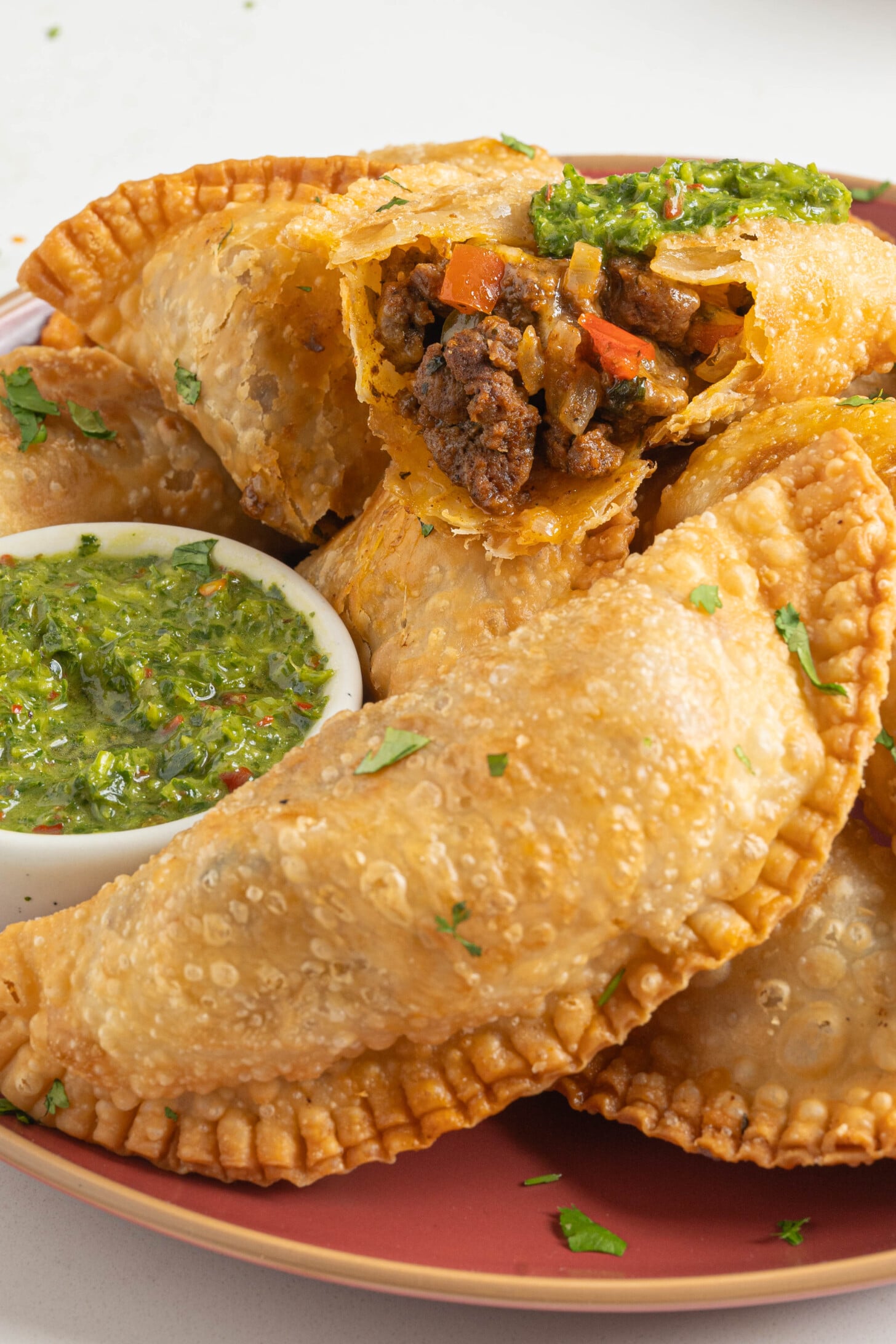 A plate of ground beef empanadas.