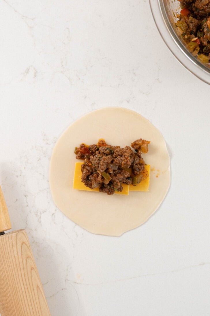 An empanada stuffed with ground beef.