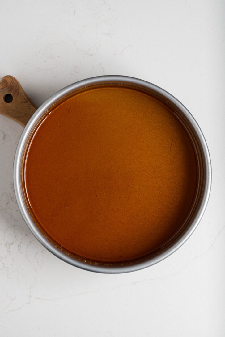 Melted sugar in a flan pan.