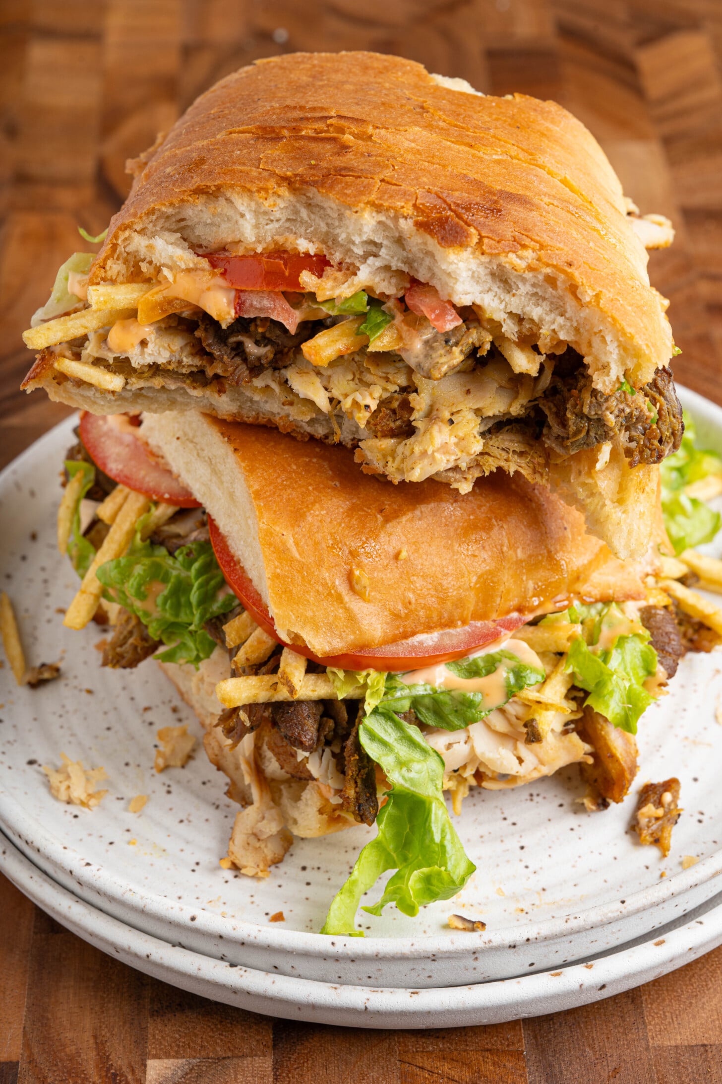 A tripleta sandwich on a plate.